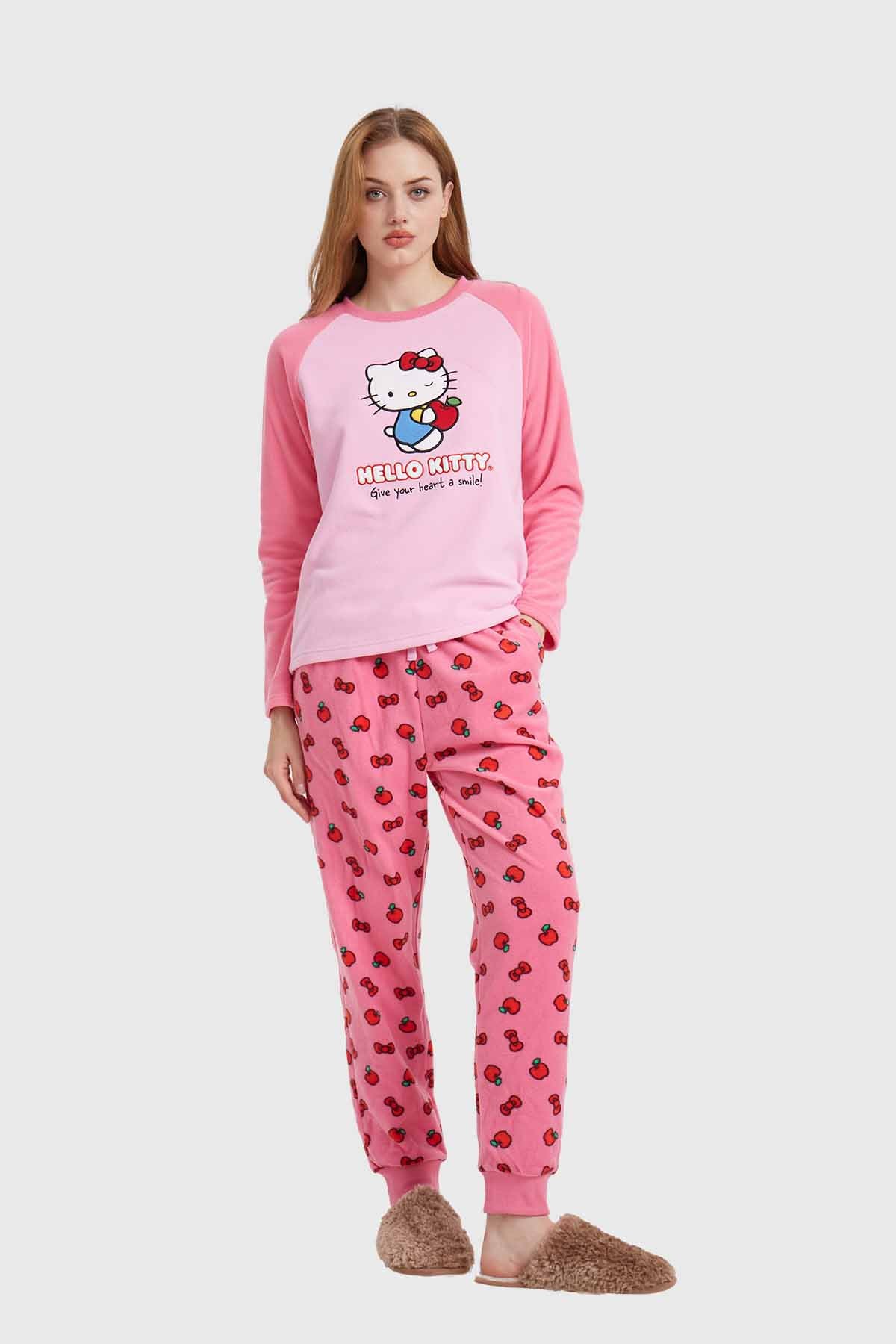 Pijama rosa de Hello Kitty con camiseta de manga larga y pantalones decorados con cerezas, ideal para los fans de la icónica gatita.
