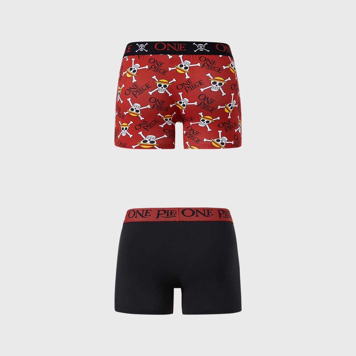 Bóxer rojo y negro de One Piece con estampado de calaveras y el logo de la serie en rojo, presenta a Luffy en acción en un diseño divertido y cómodo.
