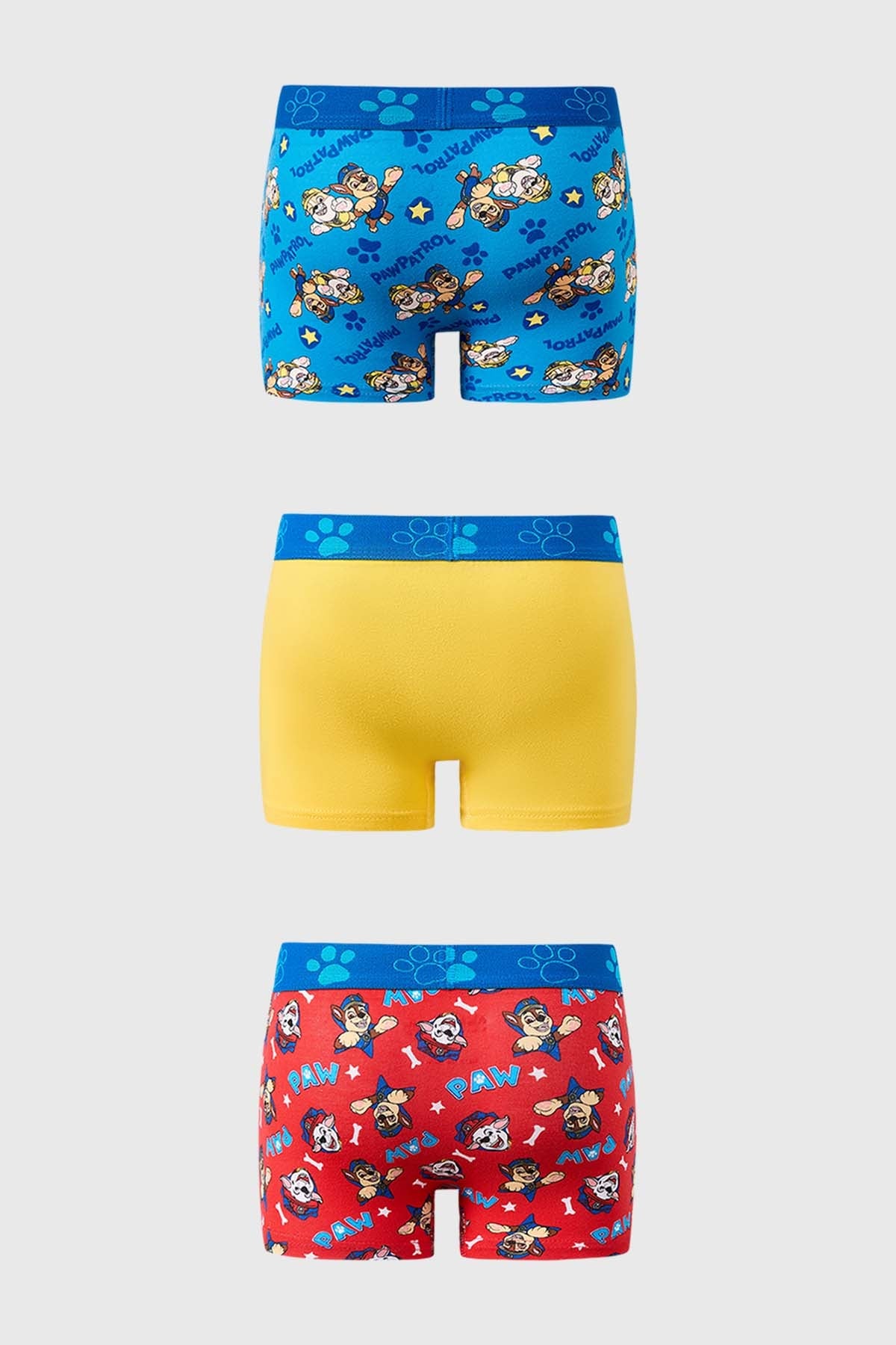 Bóxer tripack de Paw Patrol con diseño azul, amarillo y rojo, presenta a los cachorros en acción, ideal para fans de la serie.