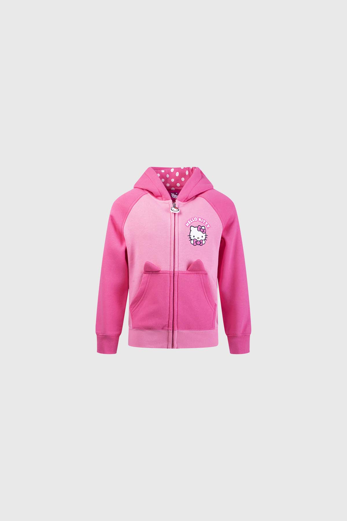 Polerón rosado con capucha y estampado de Hello Kitty en el pecho, interior con puntos, ideal para fans de la icónica gatita de Sanrio.