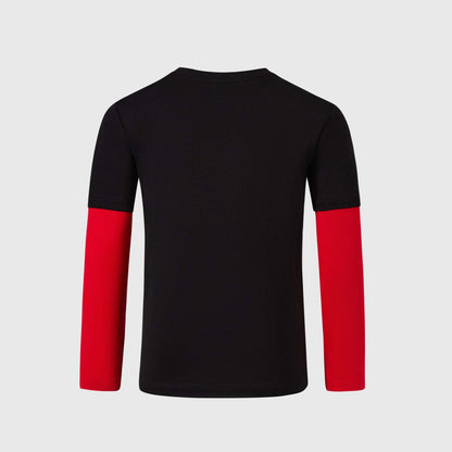 Polera negra de Paw Patrol con estampado de Marshall, un perro bombero con gorra roja y fondo escudo rojo, ideal para pequeños héroes en acción.