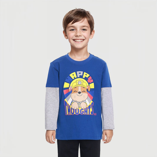 Polera azul de Paw Patrol con diseño de Rubble, un perro constructor sonriente en el centro, con texto colorido que dice 'HAPPY THOUGHTS', ideal para fans.