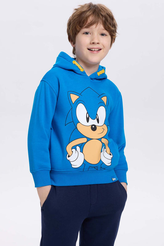 Polerón azul con capucha de Sonic, presenta un diseño gráfico del icónico erizo en el centro, resaltando su actitud desenfadada y velocidad.