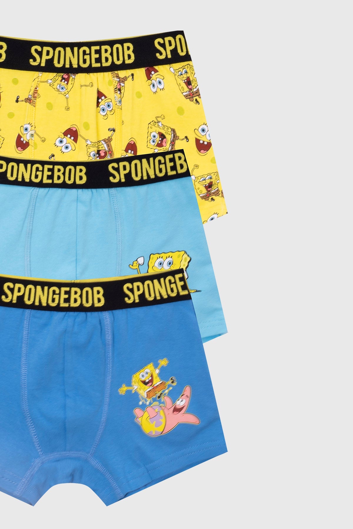 Boxer tripack de Bob Esponja en amarillo y azul con estampados divertidos del personaje en acción, ideal para los fanáticos de Nickelodeon.