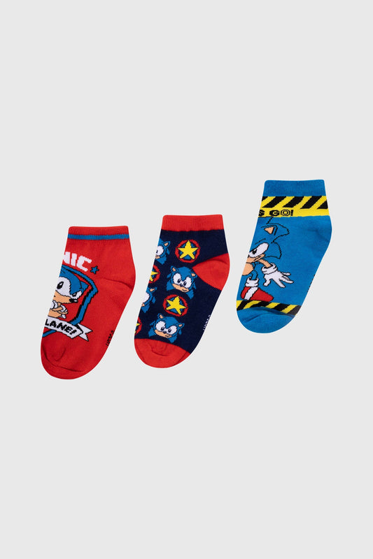 Tripack de calcetas Sonic con diseño en rojo, azul y negro que incluye ilustraciones del icónico erizo en acción, perfecto para fans de Sega.